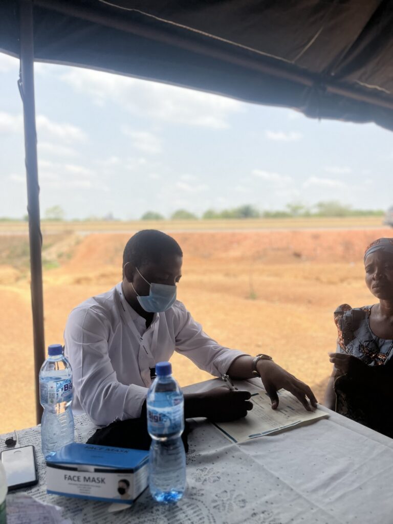 A health worker speaking with a beneficiary during the OAKonsult medical outreach